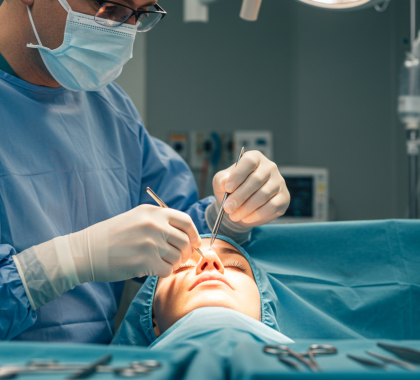 Surgeon preforming surgery on patient Surgeon preforming surgery on patient